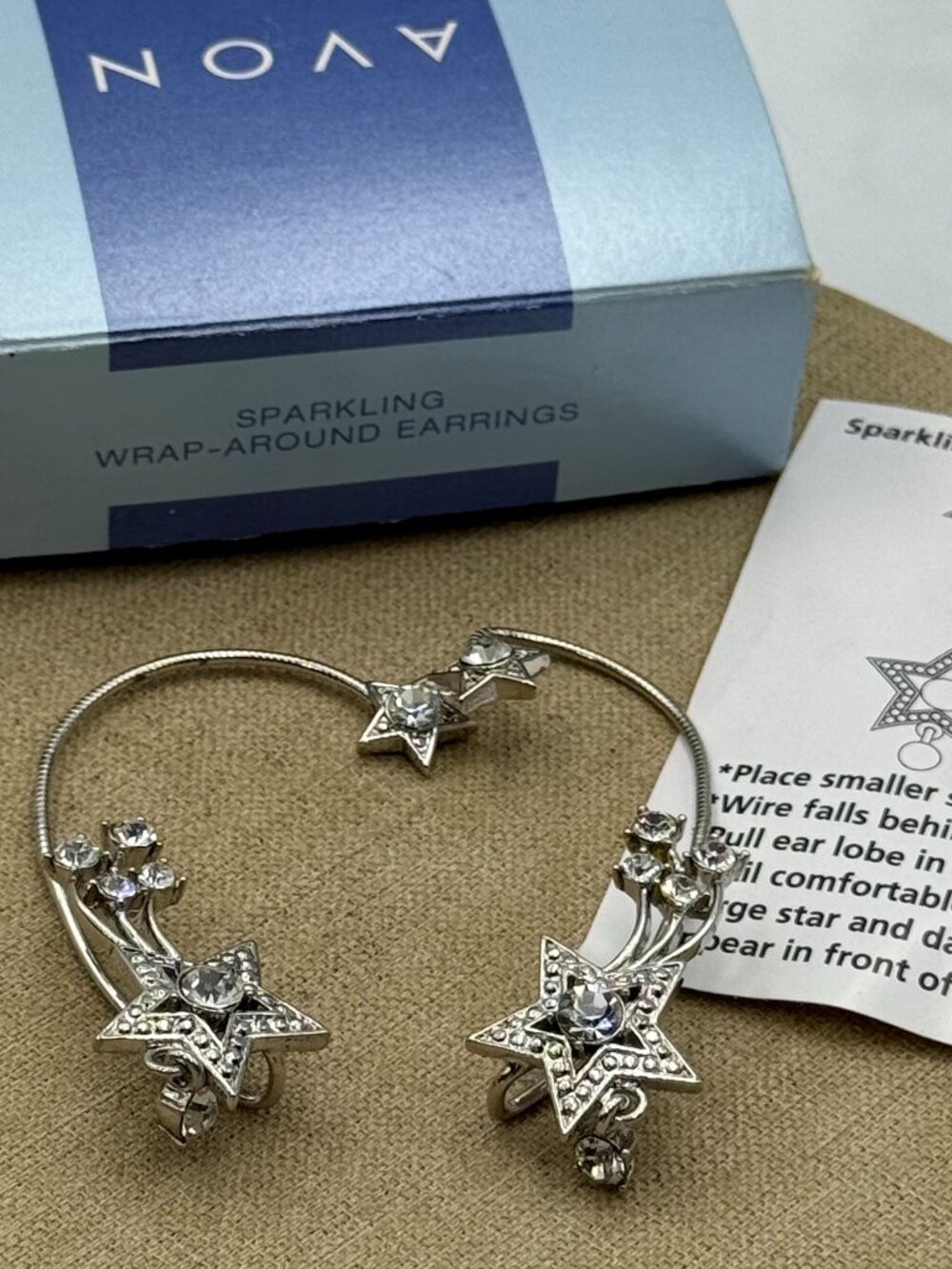 set of two avon sparkling wrap around star hoops
